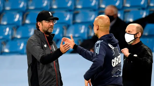 Liverpool manager Jurgen Klopp and Manchester City manager Pep Guardiola