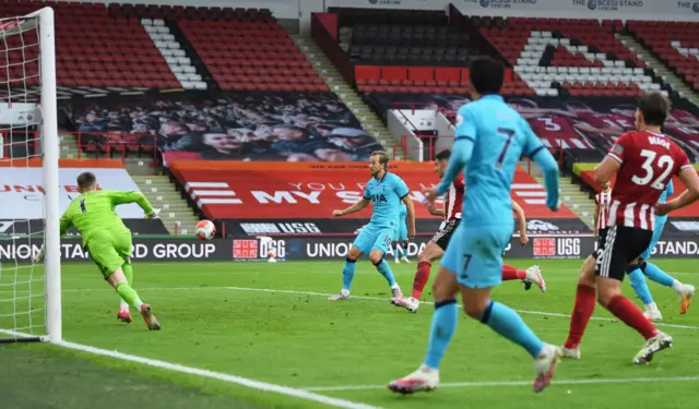 Tottenham Hotspurs' Harry Kane scores their first goal