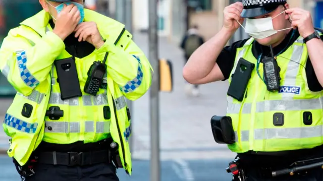 Police officers with face masks