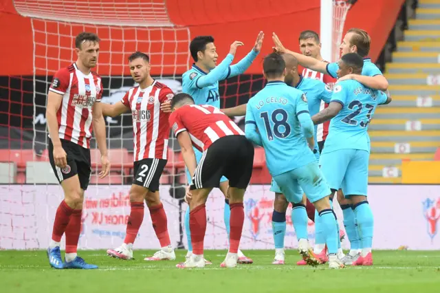 Harry Kane of Tottenham Hotspur celebrates with his team mates