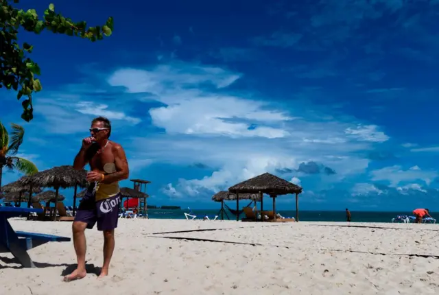 Tourist on beach in Bahamas