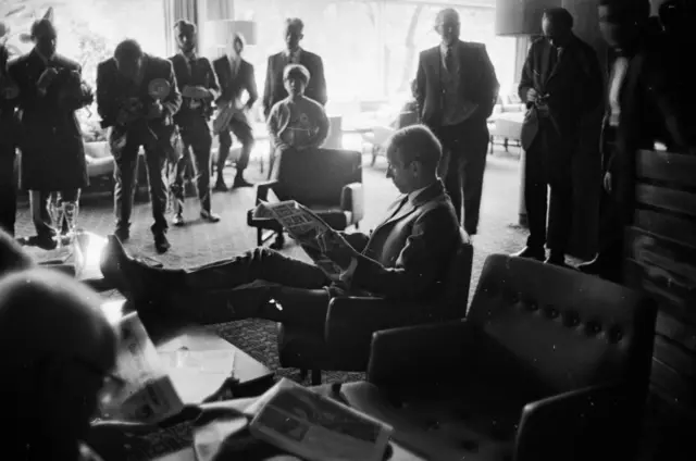 Jack Charlton reads a newspaper