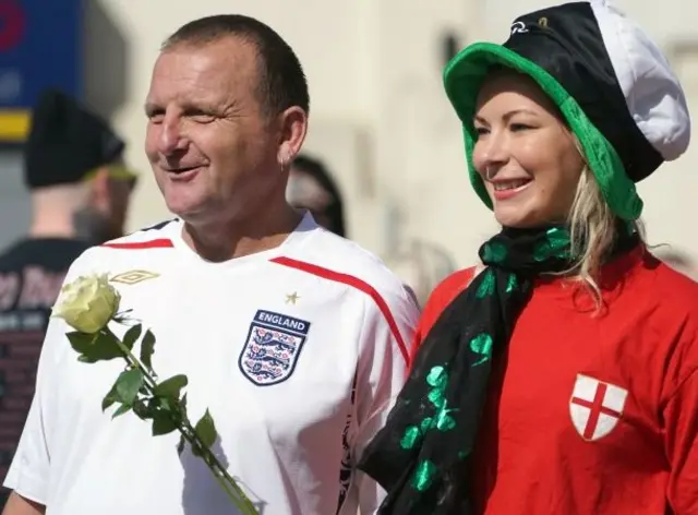 Couple in football shirts