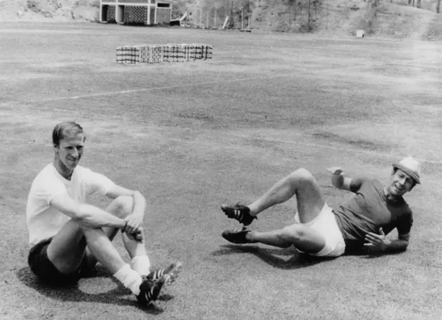 Jack and Bobby Charlton relax at training