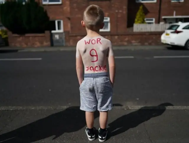 Boy with number 9 on his back