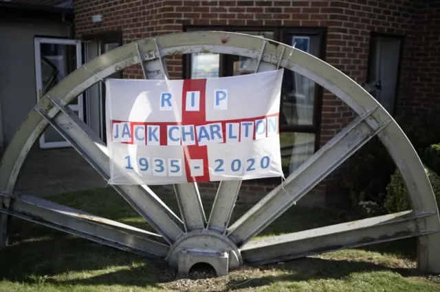 Tribute flag on old mine wheel