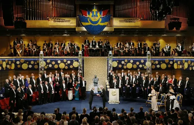 Japanese scientist Akira Yoshino (C, L) accepts the Nobel Prize in chemistry from Swedish King Carl XVI Gustaf during a ceremony at Stockholm