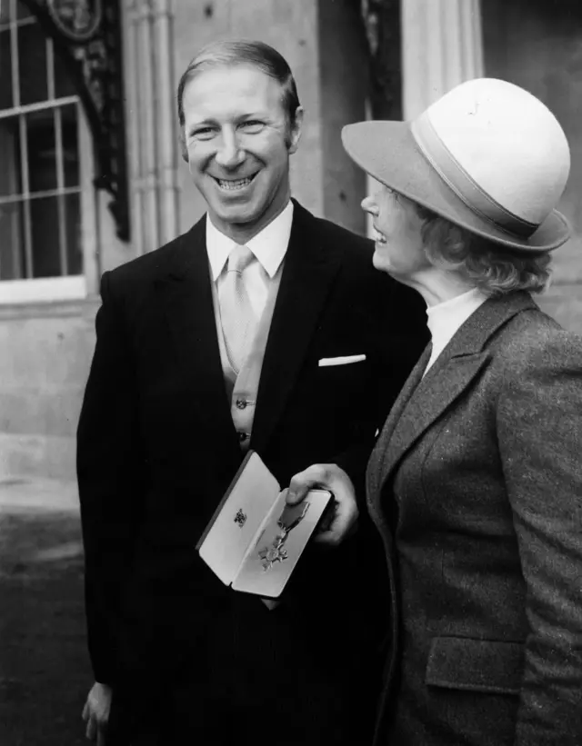 Charlton with OBE medal