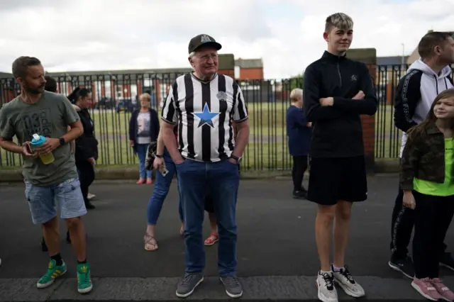 Man in Newcastle shirt