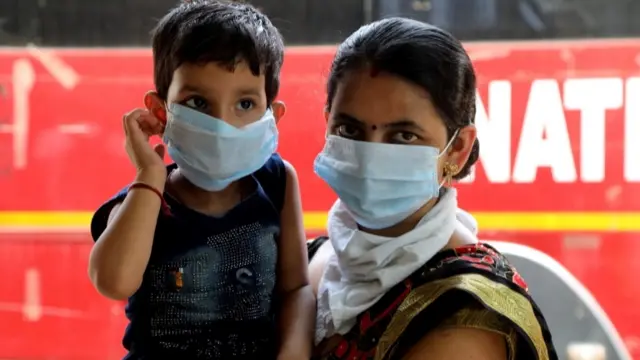 Woman and child with face masks