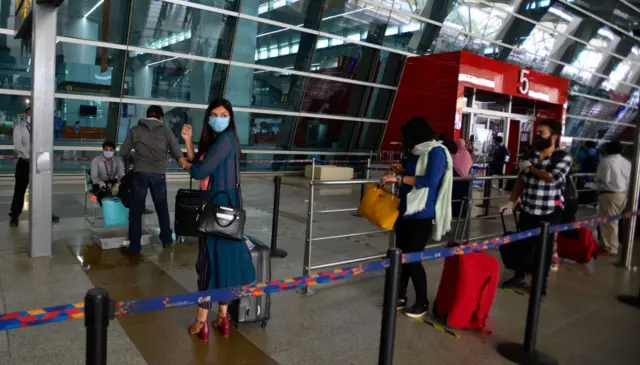 Passengers at Terminal 3 at Delhi's international airport