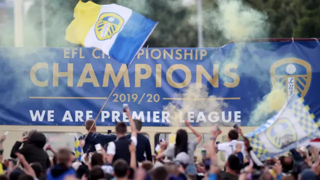 Supporters in front of a bus