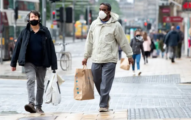 Shoppes in face coverings in Edinburgh's Princes Street