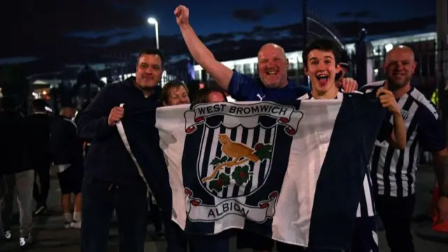 West Bromwich Albion fans celebrate their side being promoted the Premier League