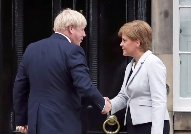 Scotland"s First Minister Nicola Sturgeon welcomes Prime Minister Boris Johnson outside Bute House in Edinburgh