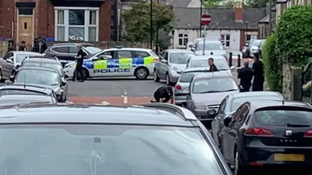 Police searching around a car