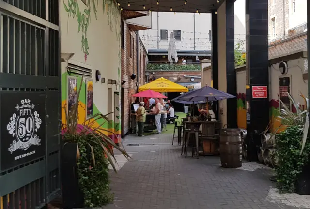 People drink at a beer garden in Edinbugh