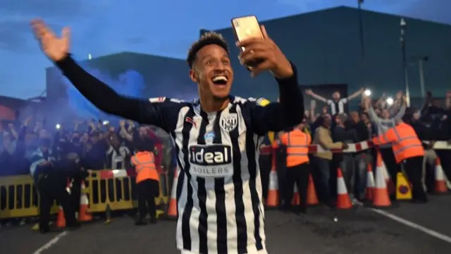 Callum Robinson of West Bromwich Albion celebrate with the fans outside the stadium