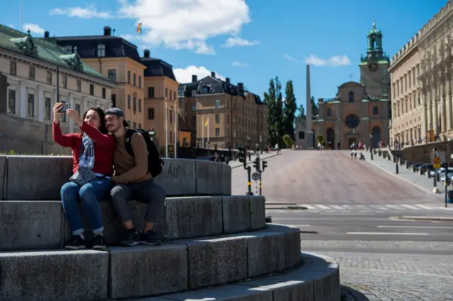 Two people pose for a picture in Stockholm