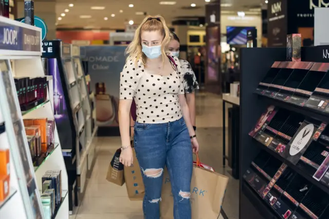 Shoppers wearing face masks