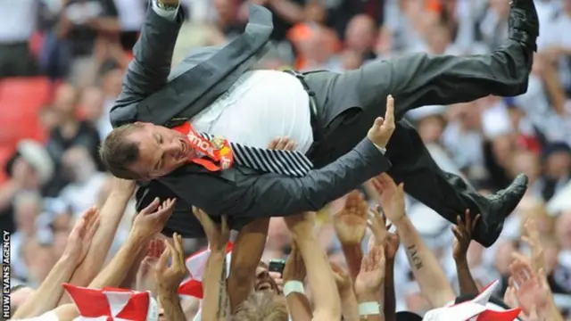 Brendan Rodgers was thrown into the air by his Swansea City players after Championship play-off final success in 2011