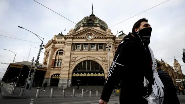 Melbourne man wearing a face mask