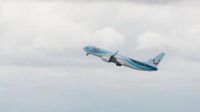 TUI plane flying in sky