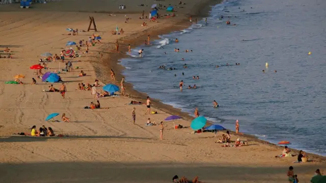 People cool off at Calella beach, during the coronavirus disease (COVID-19) outbreak in Calella, north of Barcelona, Spain