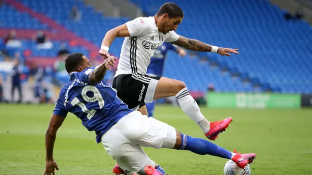 Anthony Knockaert of Fulham is tackled by Nathaniel Mendez-Laing of Cardiff City