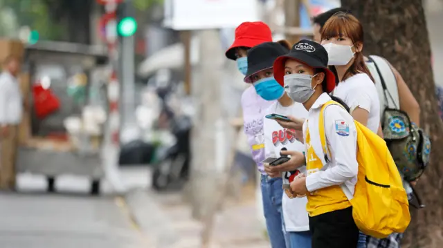 People wearing face masks in Hanoi, Vietnam, 26 July 2020