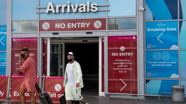 Passengers arrive at Birmingham Airport