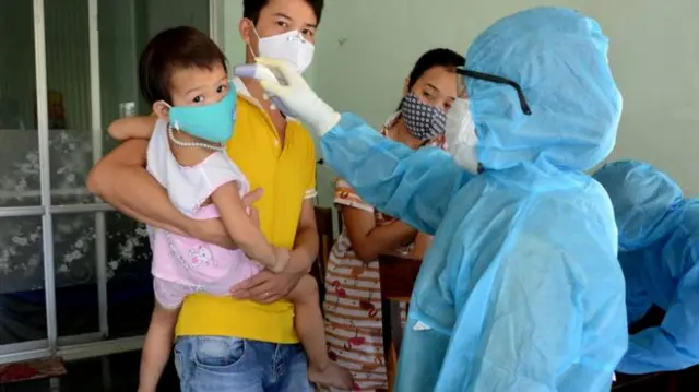 A child having their temperature taken