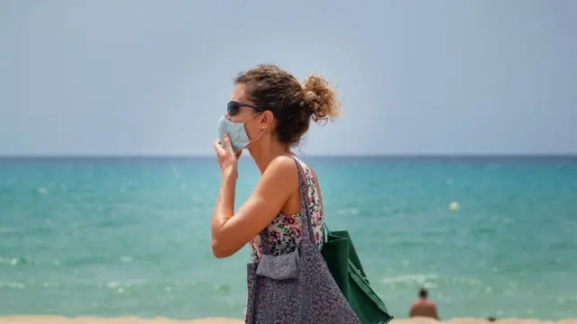 A woman in Spain wearing a mask