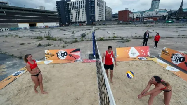 Team England players played a bit of beach volleyball in front of the weeds