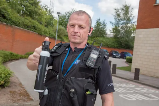 Police officer with spray