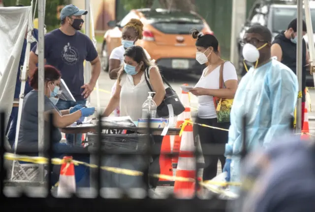 People queue to get the COVID-19 coronavirus walk-up testing service in Florida