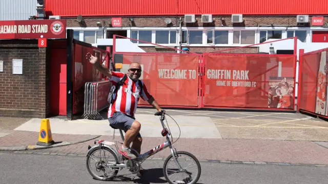 Fan on bike outside Griffin Park tonight