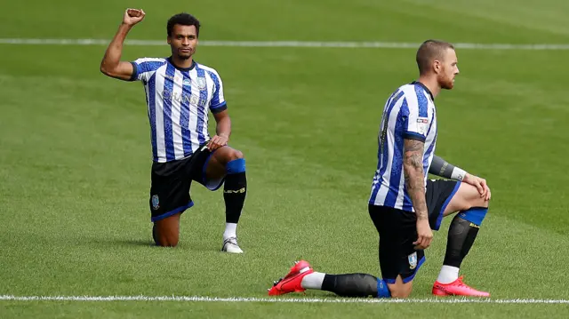 Jacob Murphy (left) and Connor Wickham take a knee