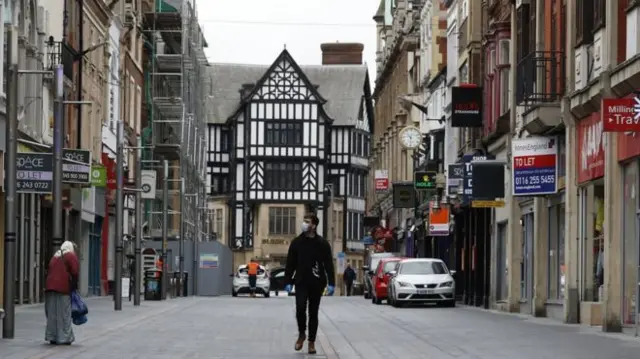 A man walking in Leicester city centre