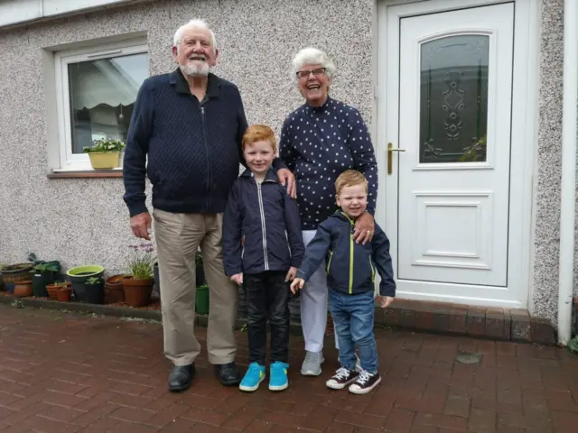 Bobby and Ellen Bell with their grandchildren Noah and Isaac