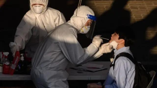 Medics testing a student in South Korea