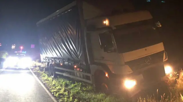 A lorry on the grass verge