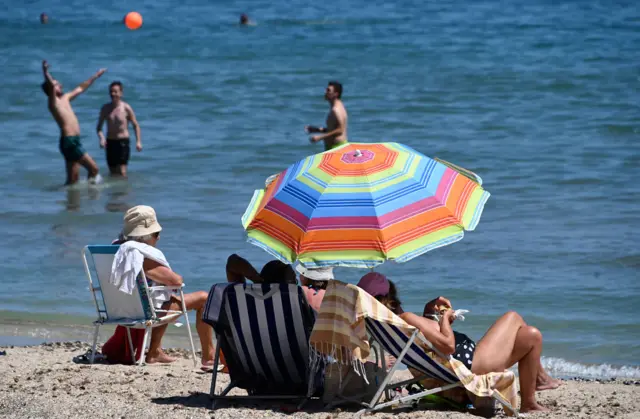 Beach-goers at Palavas-les-Flots, southern France