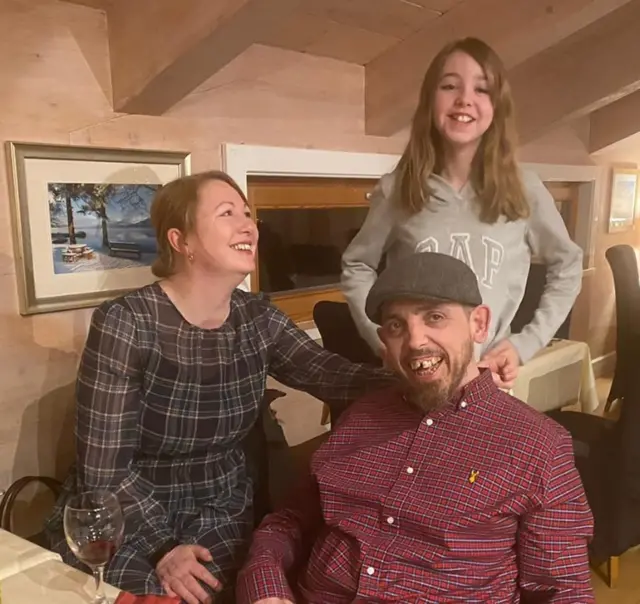 Richard Luke with his wife and daughter