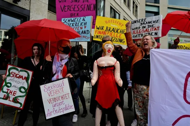 Sex workers holding placards demonstrate in Berlin