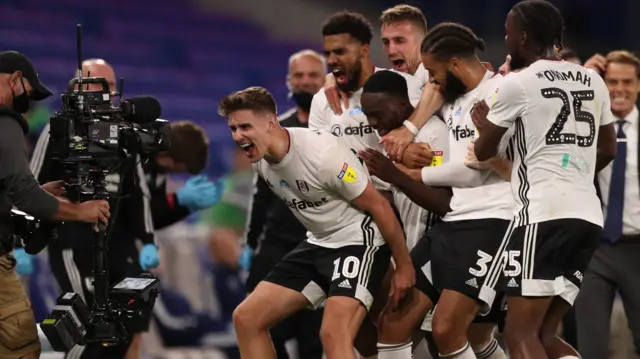 Fulham celebrate a goal against Cardiff