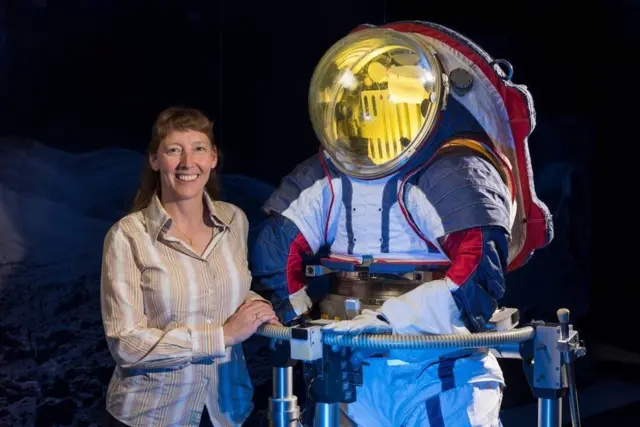 Advanced spacesuit designer Amy Ross of NASA's Johnson Space Center stands with the Z-2, a prototype spacesuit.