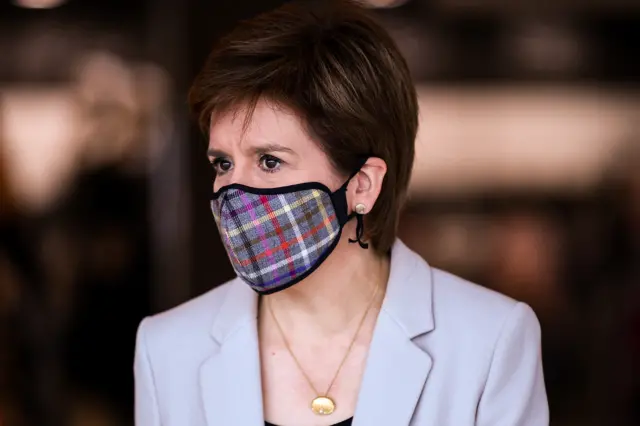 First Minister of Scotland Nicola Sturgeon wears a Tartan mask as she visits New Look at Fort Kinnaird Retail Park, in Edinburgh