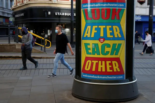 People wearing face coverings in Manchester