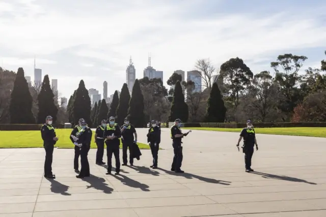 Police patrol near the Shrine of Remembrance in Melbourne, Australia